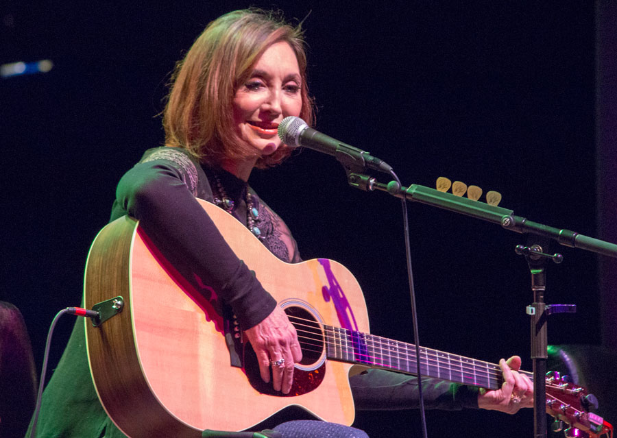 pam tillis closeup image of her playing guitar at paramount center for the arts