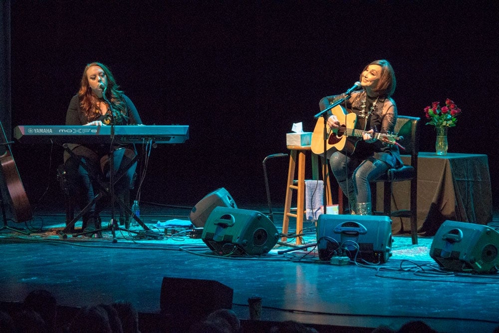 musician haley sullivan backs up pam tillis on keys and vocals on stage in st. cloud, minnesota