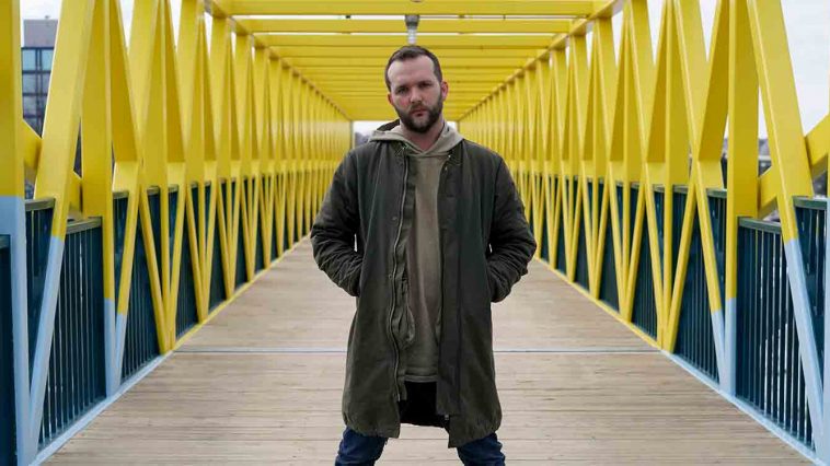 Man standing on yellow bridge minnesota