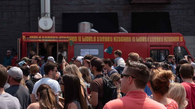 Food truck making food for crowd