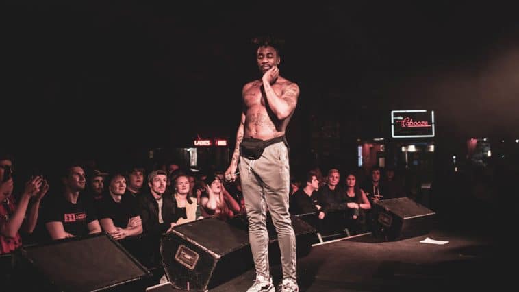 Fans looking admirably at Dax while he performs in Minneapolis, Minnesota at The Cabooze