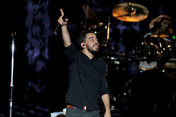 Times Bandleaders Have Stopped a Concert to Help a Fan mike shinoda on stage holding up a microphone