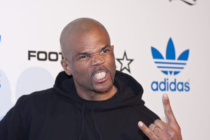 hip hop artists that changed the game DMC on the red carpet making a symbol with his hands