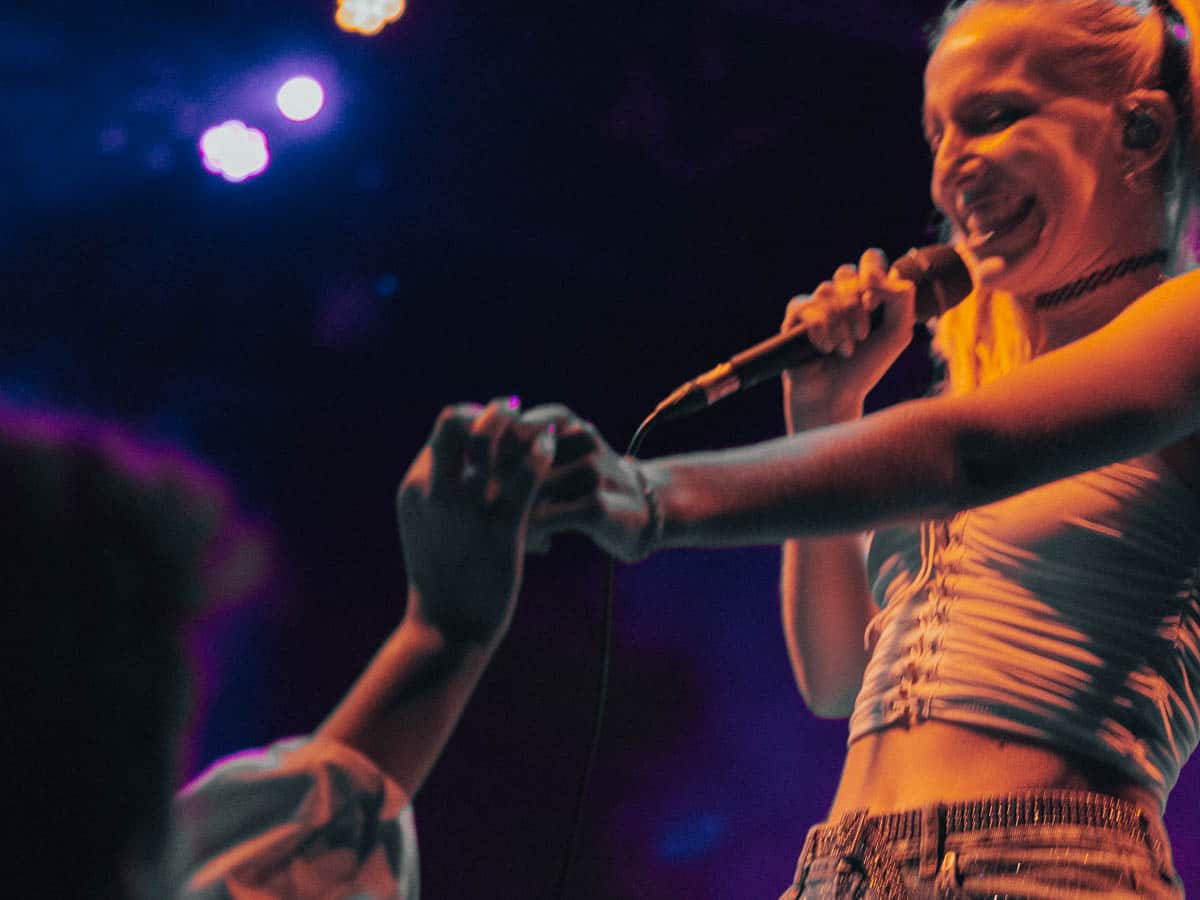 Maude connects with a fan while on stage