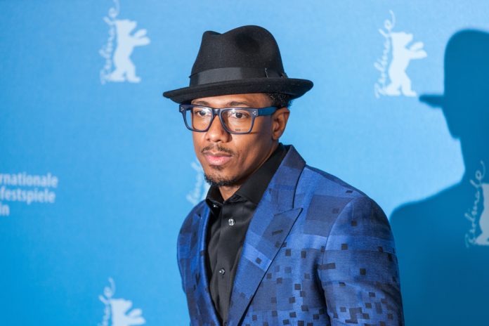 nick cannon on the red carpet in a blue suit