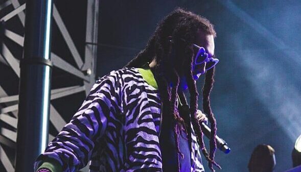 takeoff performing on stage