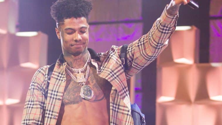 blueface's net worth blueface's net worth image of blueface on stage holding a microphone