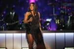 celebrities who are anti-vaxxers Toni Braxton's net worth toni braxton on stage in a black fringe dress