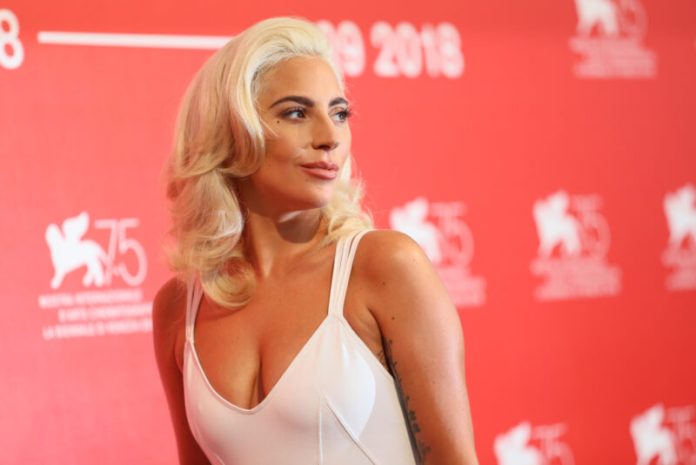 Lady Gaga richest musicians lady gaga in a white dress on the red carpet