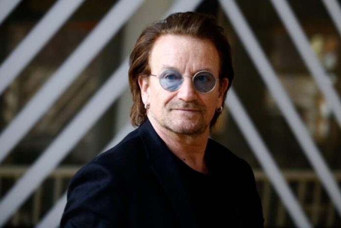 bono in sunglasses looking straight ahead