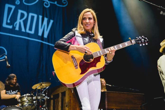 sheryl crow facts sheryl crow playing guitar on stage
