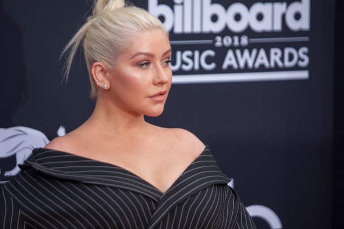 christina aguilera on the red carpet in a black dress