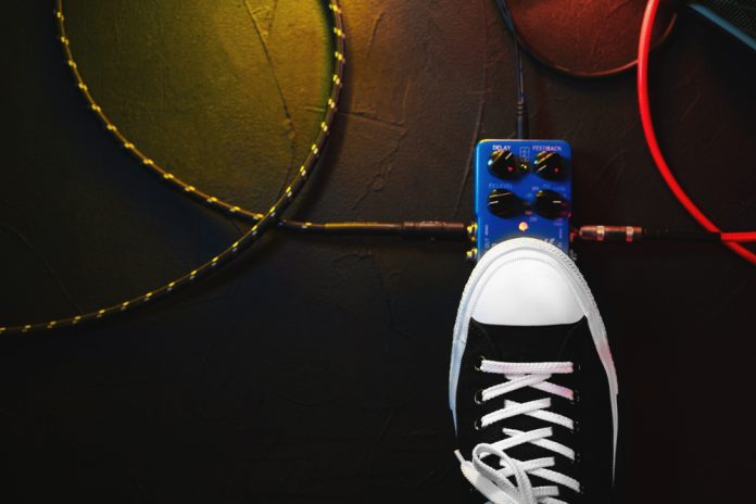 Close Up Of Guitar,Player Foot Pressing Pedal