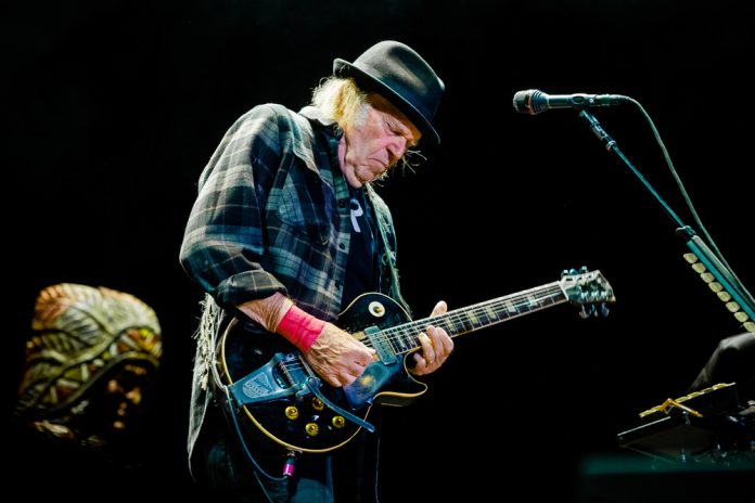neil young playing guitar