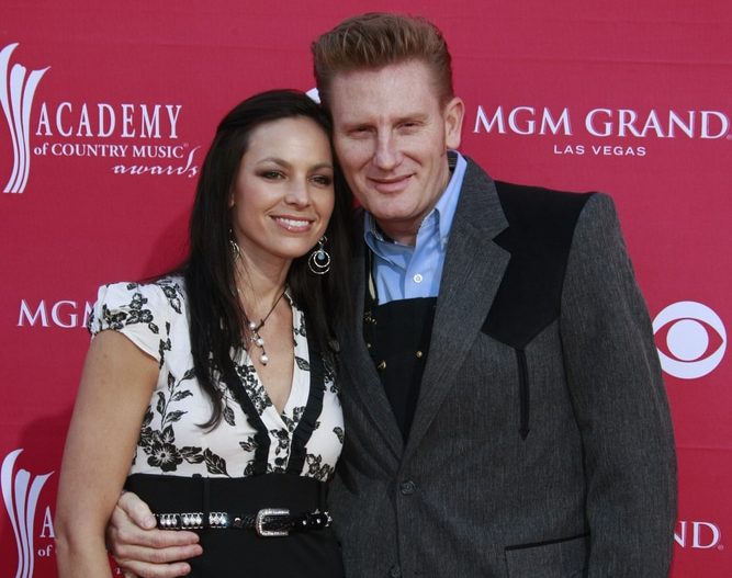 joey and rory on the red carpet against a red backdrop
