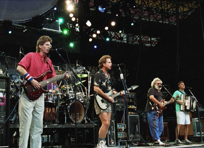 the grateful dead's net worth image of the grateful dead performing on stage