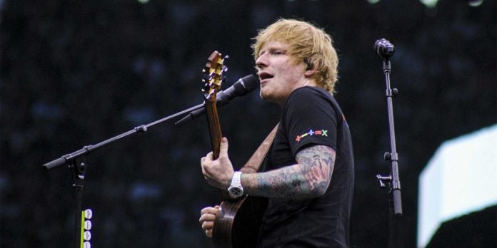 ed sheeran on stage playing guitar