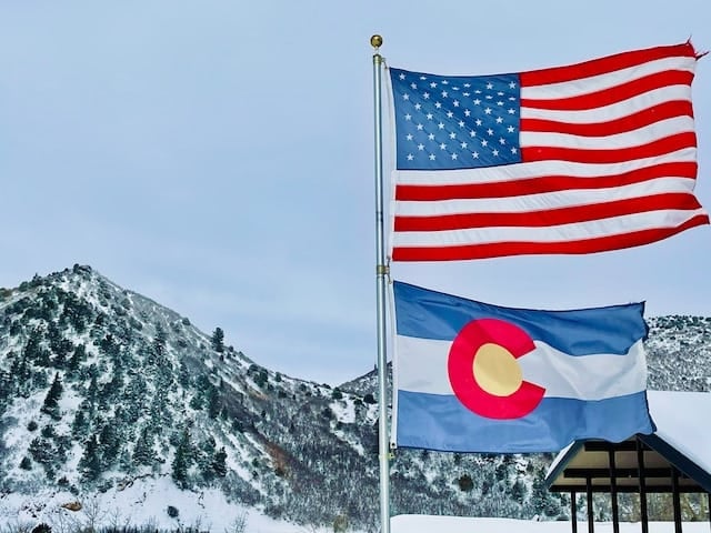 famous people from colorado an image of the colorado and american flag on a pole in colorado