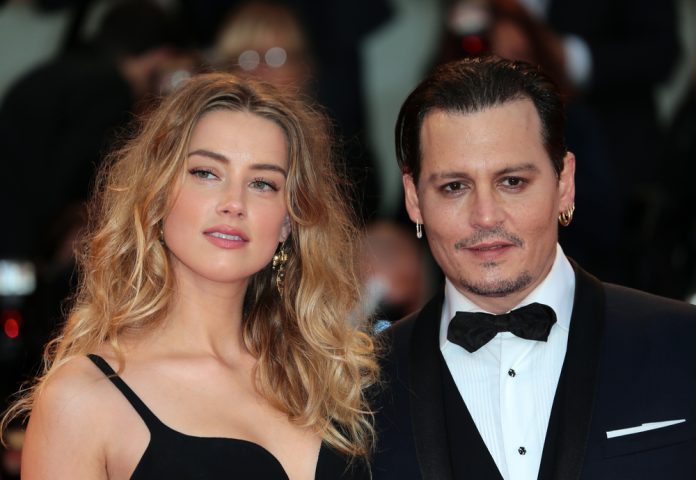 famous celebrities who are atheists amber heard and johnny depp on the red carpet