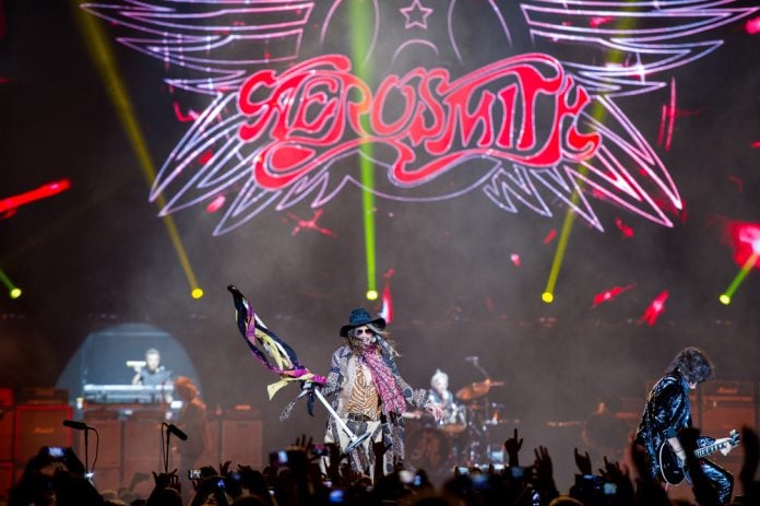 bands that still tour but should have hung it up the band aerosmith performing on stage in front of a crowd
