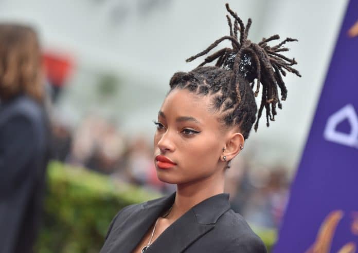 willow smith with her hair tied up arriving for an event