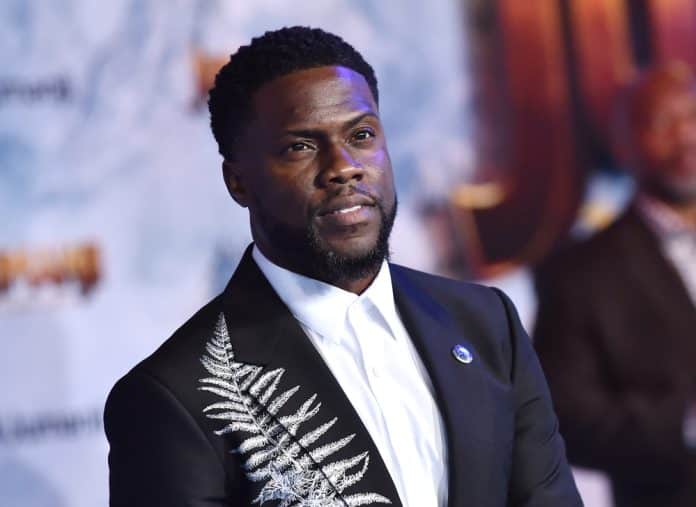 kevin hart in a suit at an event