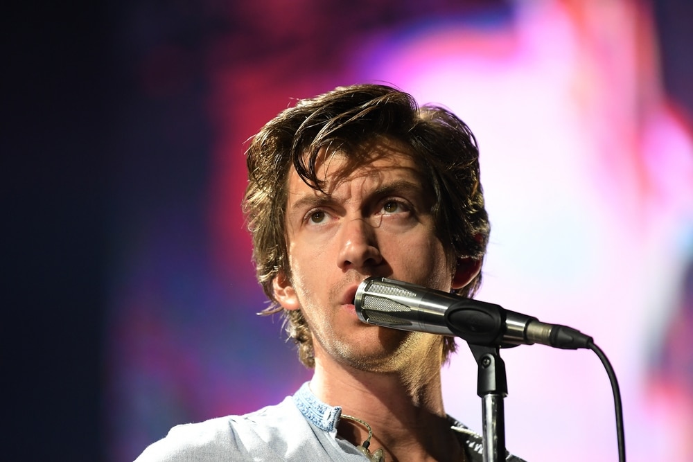 alex turner of the artic monkeys performing on stage