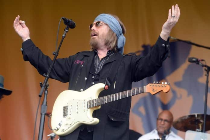 celebrities who overdosed famous singers who went bankrupt tom petty on stage holding his arms out