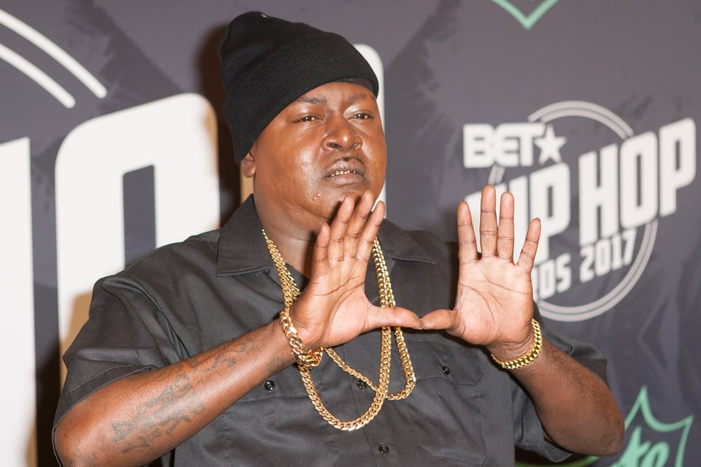 rappers who went bankrupt rapper trick daddy arriving at an event holding his hands up