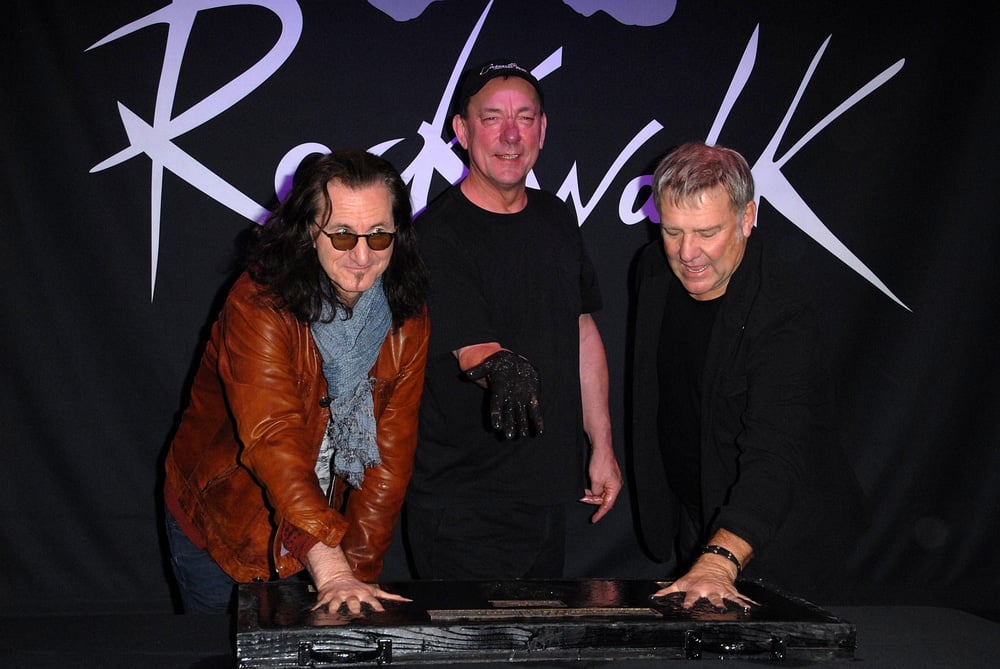 how did neil peart die? Geddy Lee, Neil Peart, Alex Lifeson at the ceremony where RUSH is Inducted Into Guitar Center's RockWalk at Guitar Center on November 20, 2012 in Los Angeles, CA