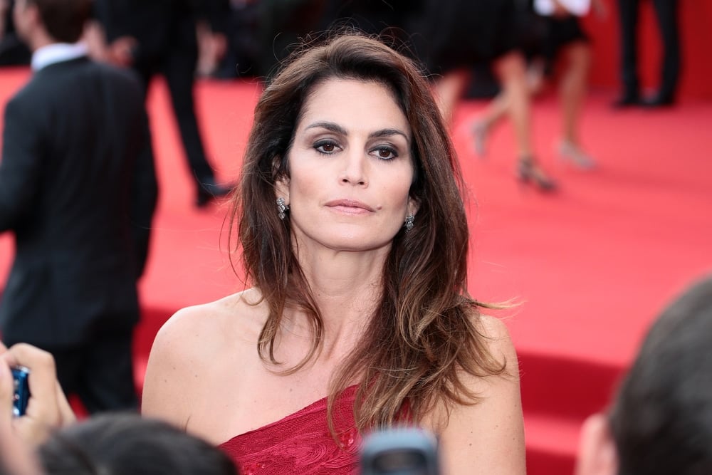 cindy crawford on the red carpet arriving for an event