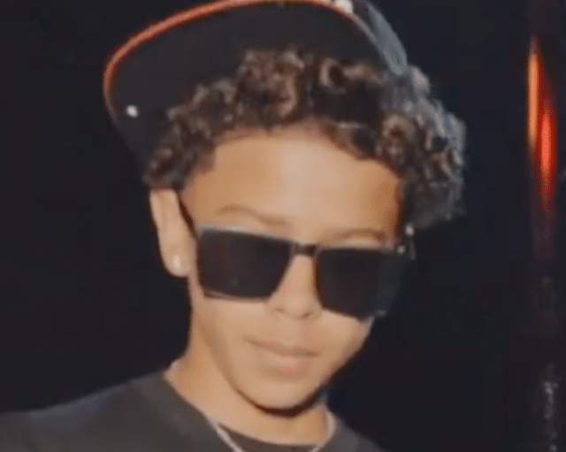 luh tyler holding a microphone on stage during a performance