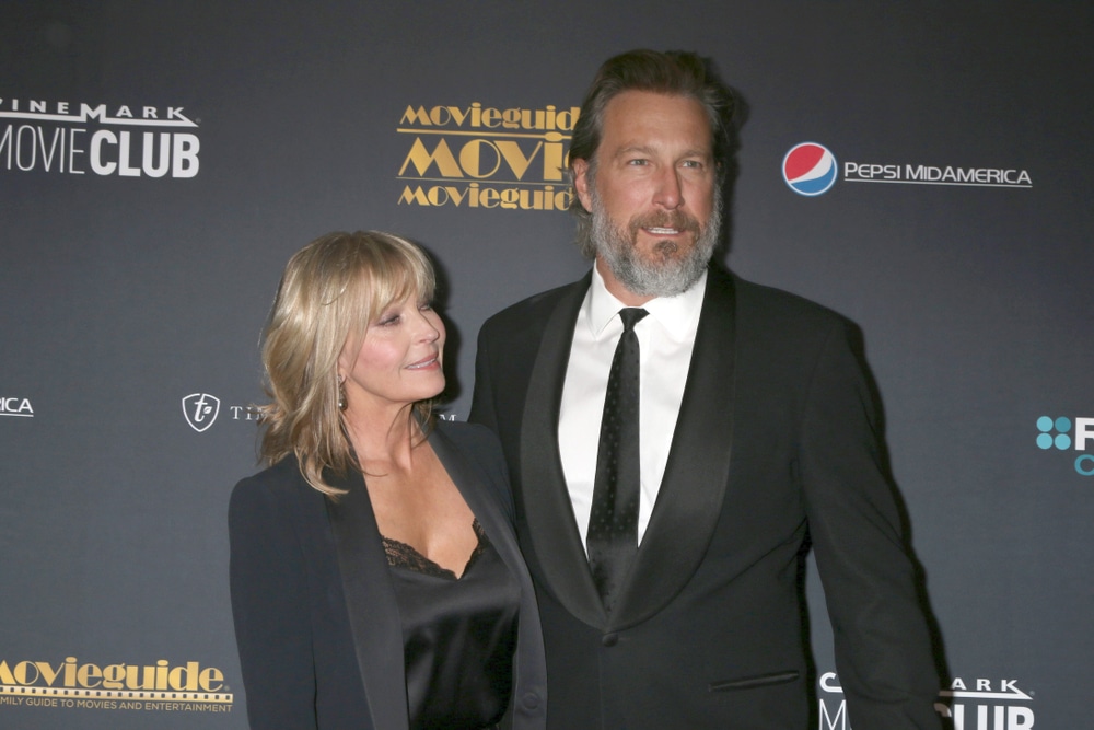 celebrities who are taller than you expected john corbett arriving at an event with a woman