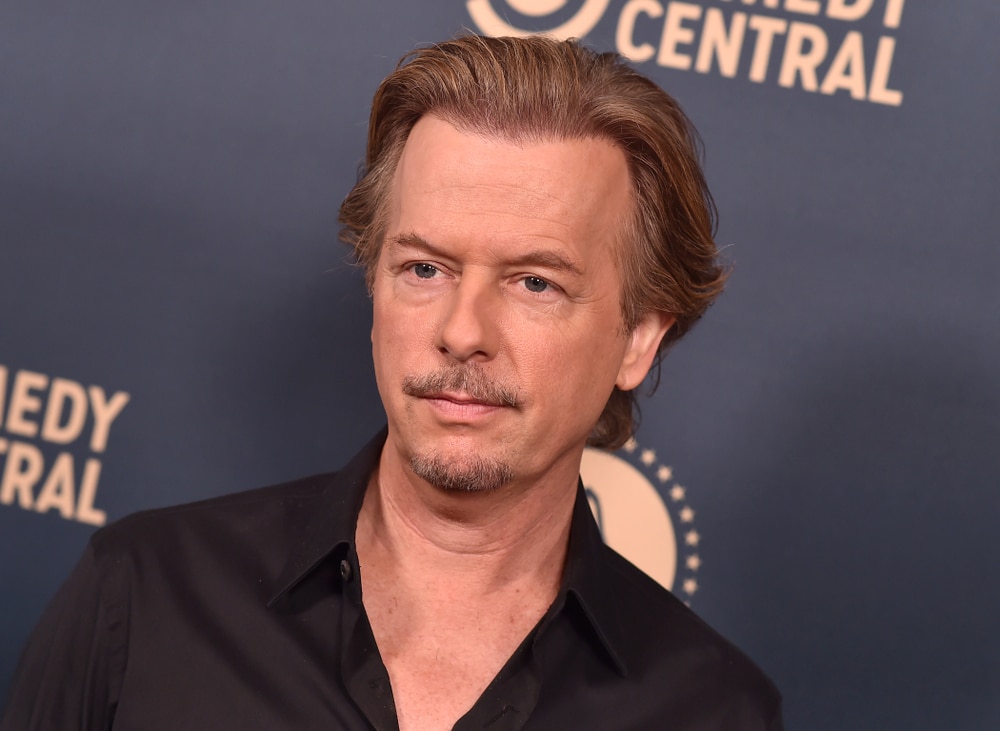david spade on the red carpet in a dark colored shirt