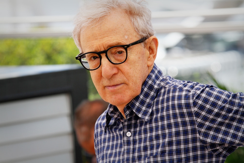 woody allen in a checkered shirt outside