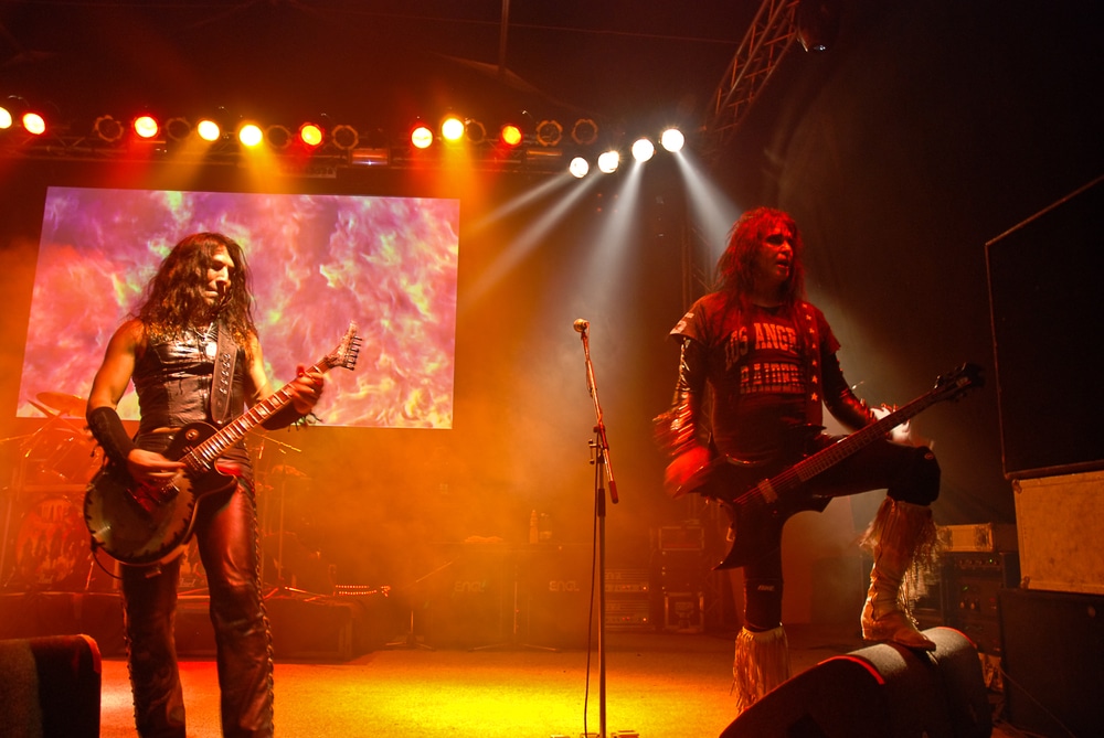 tall musicians the band wasp performing on stage