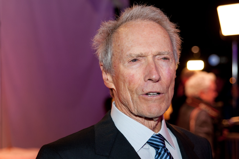 celebrities who are taller than you expected clint eastwood arriving at an event in a suit