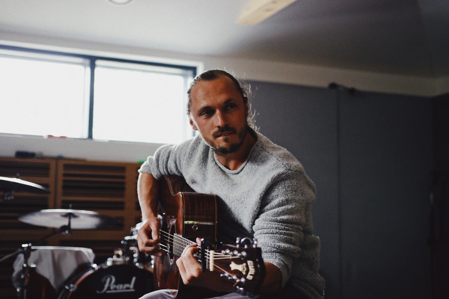 Tiz McNamara holding a guitar