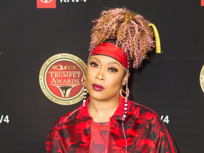 rappers who went bankrupt rapper da brat on the red carpet in a red outfit
