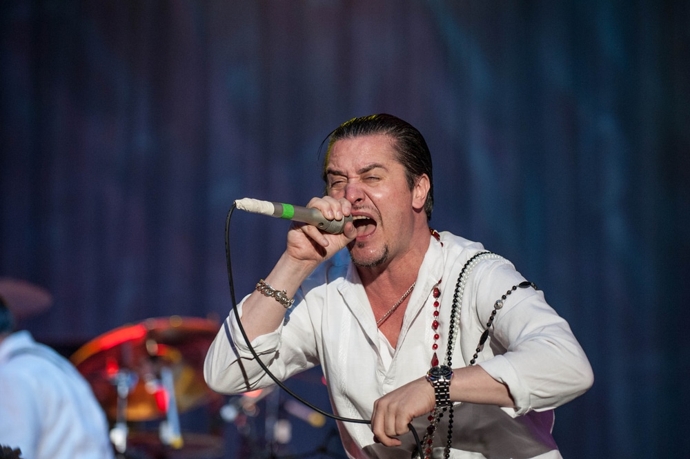 mike patton on stage singing