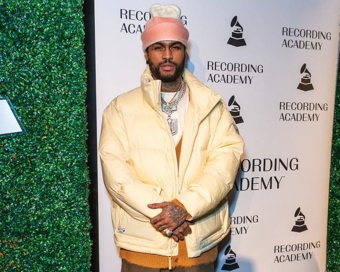 rapper dave east attending an awards celebration
