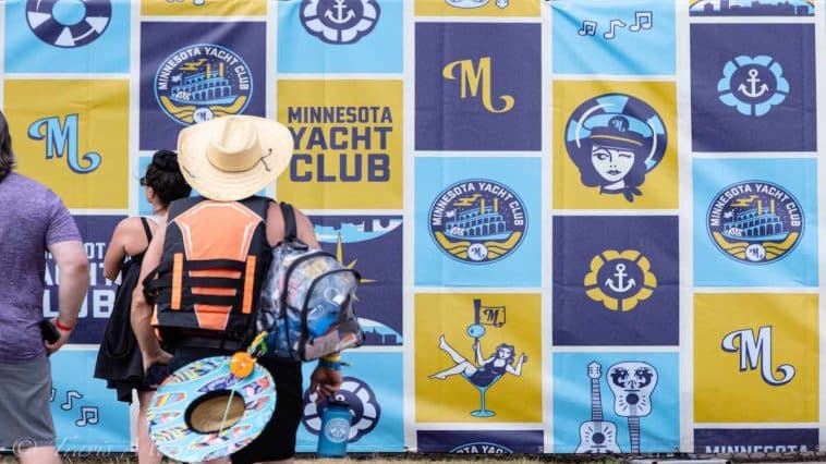 Photo by Travis Meier, Guy wears life jacket to festival with no yachts