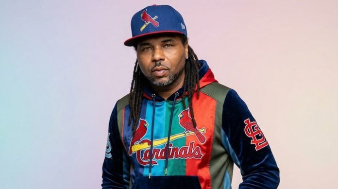 Artist young v wearing cardinals hat and shirt